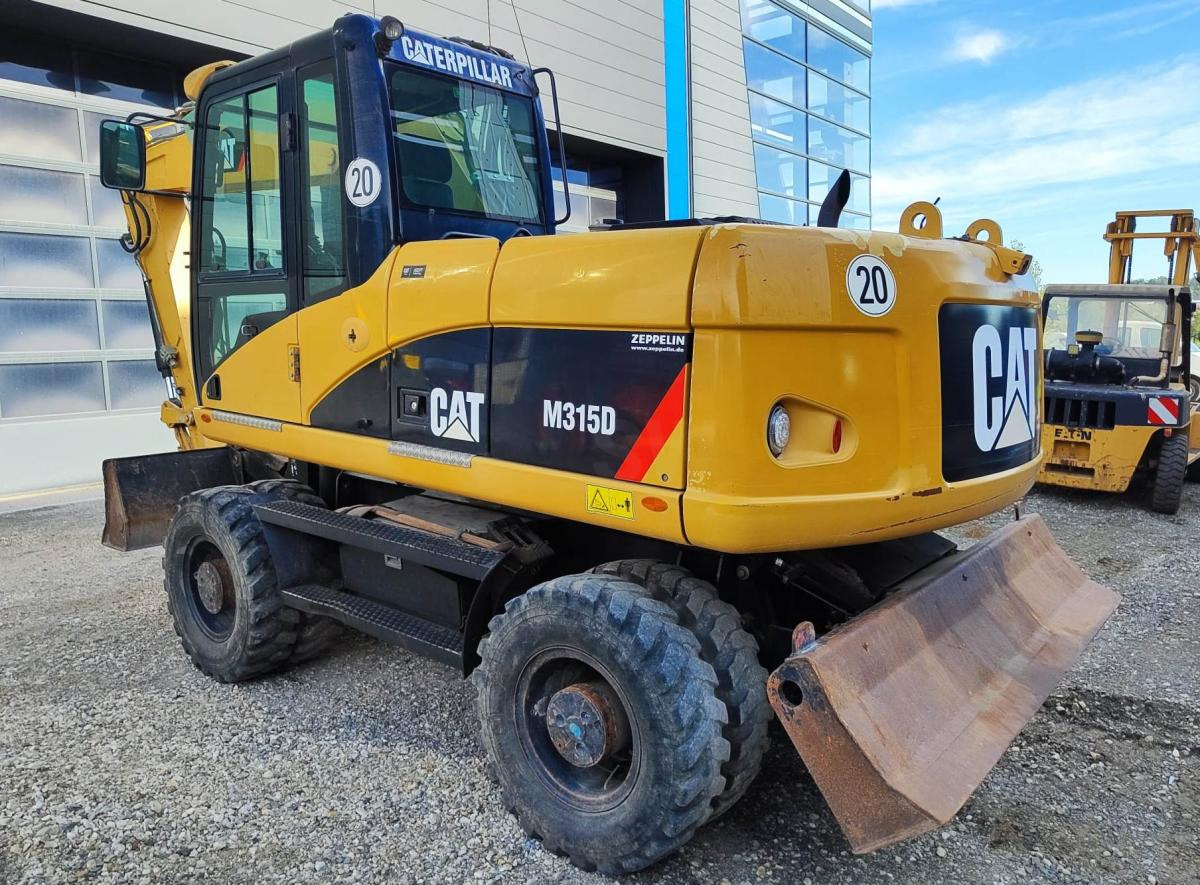 Caterpillar M315D - Hjulgraver: bilde 1 Caterpillar M315D - Hjulgraver: bilde 1