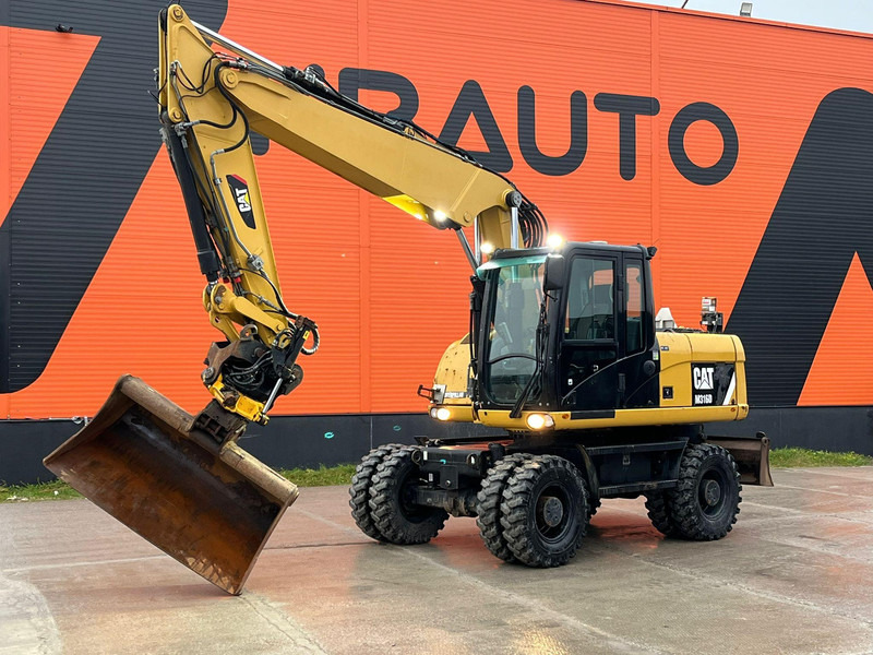 Caterpillar M316D / ROTOTILT/ AC / CENTRAL LUBRICATION / + EXTRA BUCKET - Hjulgraver: bilde 1 Caterpillar M316D / ROTOTILT/ AC / CENTRAL LUBRICATION / + EXTRA BUCKET - Hjulgraver: bilde 1