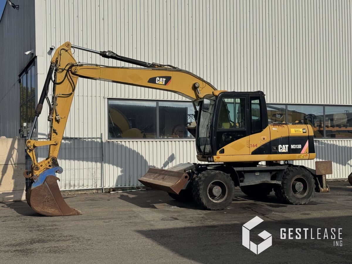 Caterpillar M313D - Hjulgraver: bilde 1 Caterpillar M313D - Hjulgraver: bilde 1