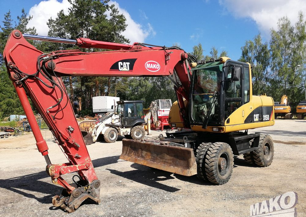 Caterpillar M315 C - Hjulgraver: bilde 1 Caterpillar M315 C - Hjulgraver: bilde 1