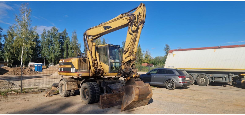 Caterpillar M 315 Rototilt - Hjulgraver: bilde 1 Caterpillar M 315 Rototilt - Hjulgraver: bilde 1