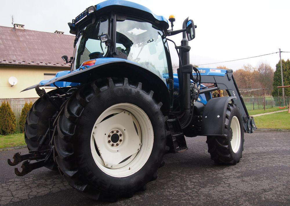 Ciągnik New Holland NH TS125A 6 cylindrów 2004 Ciągnik rolniczy New Holland TS125A - Traktor: bilde 4 Ciągnik New Holland NH TS125A 6 cylindrów 2004 Ciągnik rolniczy New Holland TS125A - Traktor: bilde 4