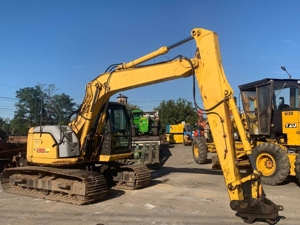 New Holland E 135 SR - Beltegraver: bilde 1 New Holland E 135 SR - Beltegraver: bilde 1