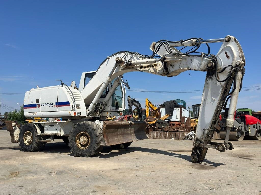 New Holland MH Plus - Hjulgraver: bilde 1 New Holland MH Plus - Hjulgraver: bilde 1