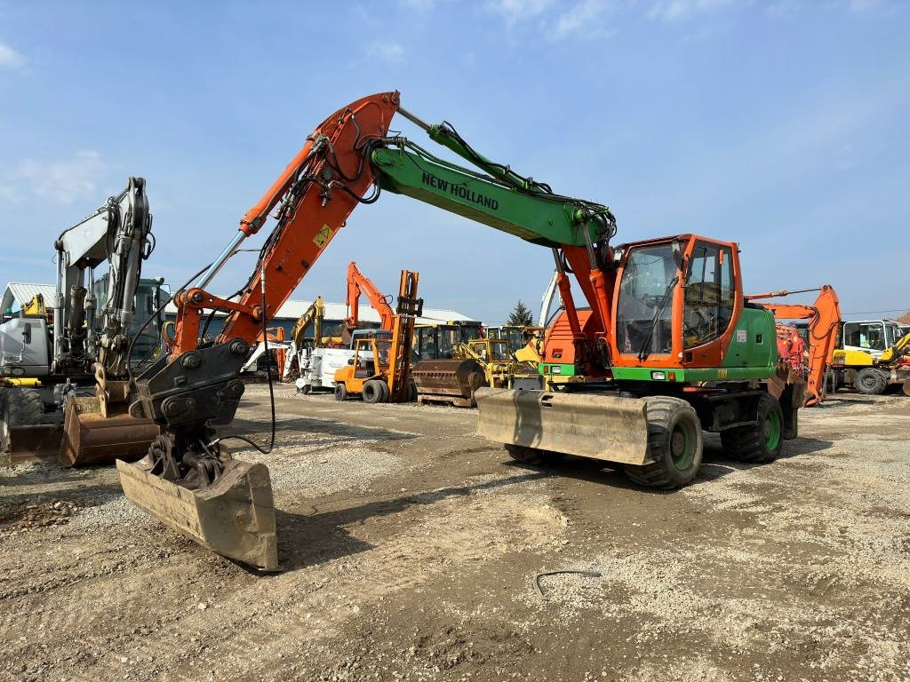New Holland MH Plus - Hjulgraver: bilde 1 New Holland MH Plus - Hjulgraver: bilde 1