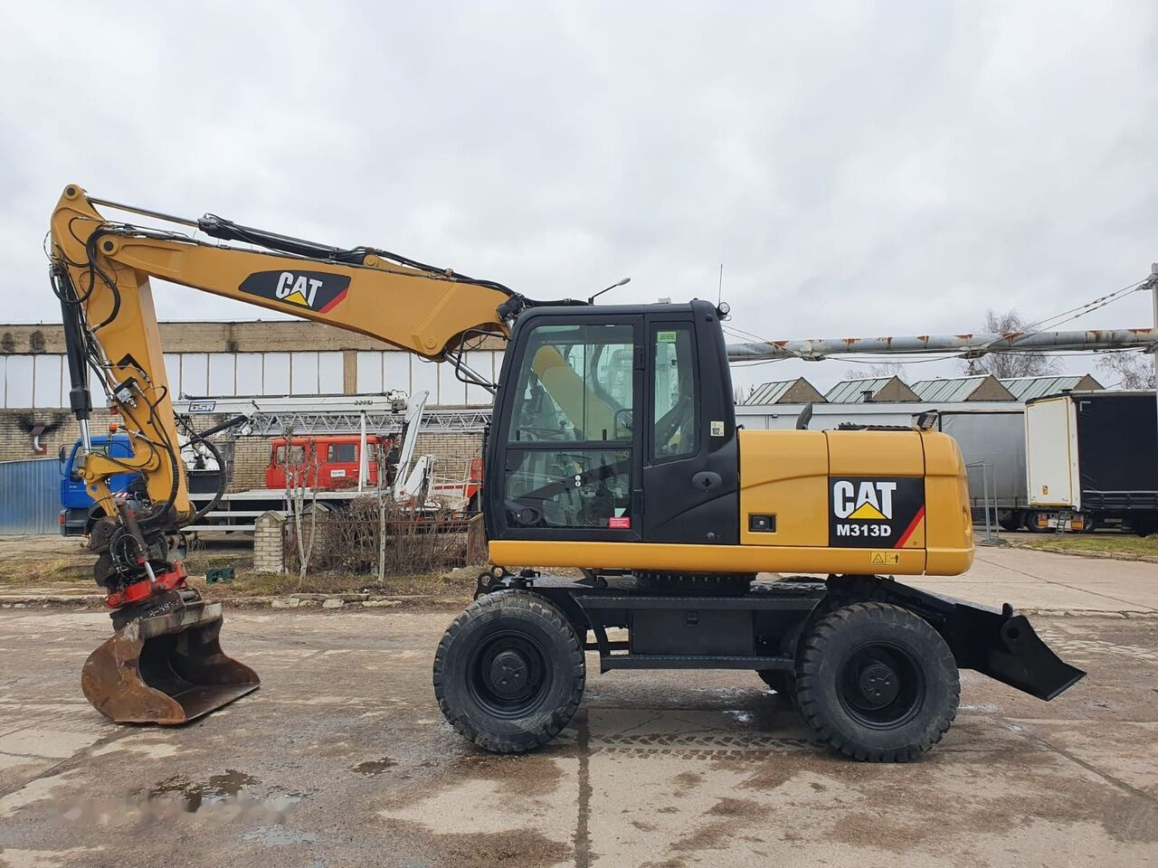 Caterpillar M 313 D Tiltrotator - Hjulgraver: bilde 1 Caterpillar M 313 D Tiltrotator - Hjulgraver: bilde 1