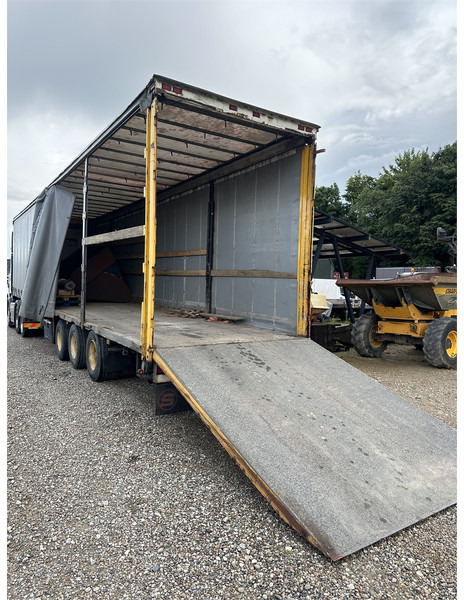 Schmitz Cargobull Machine transport trailer with bag ramp - Semitrailer: bilde 1 Schmitz Cargobull Machine transport trailer with bag ramp - Semitrailer: bilde 1