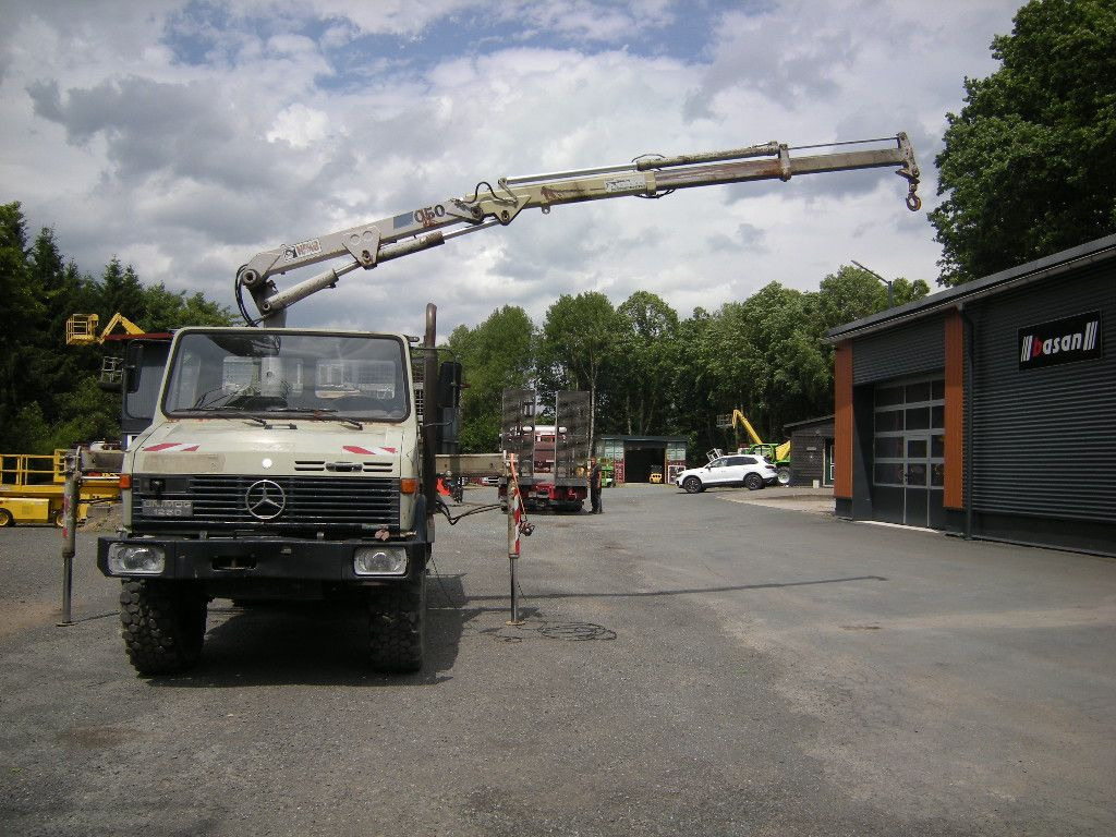 Mercedes-Benz Unimog U1250 mit Kran MKG 105 - Varebil med tipp: bilde 1 Mercedes-Benz Unimog U1250 mit Kran MKG 105 - Varebil med tipp: bilde 1