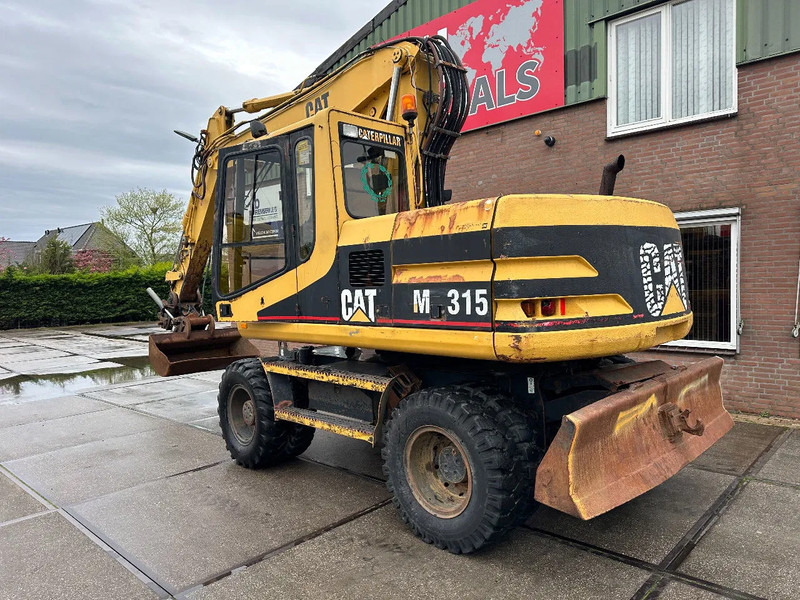 Caterpillar M315 +ROTO CE - Hjulgraver: bilde 4 Caterpillar M315 +ROTO CE - Hjulgraver: bilde 4